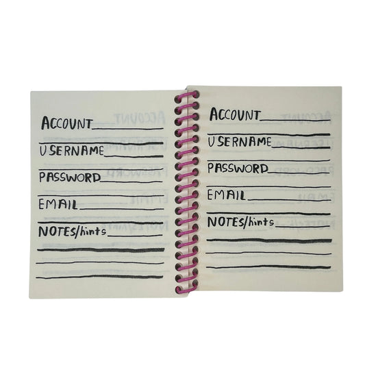 Notebook with password and account information entries on a white background