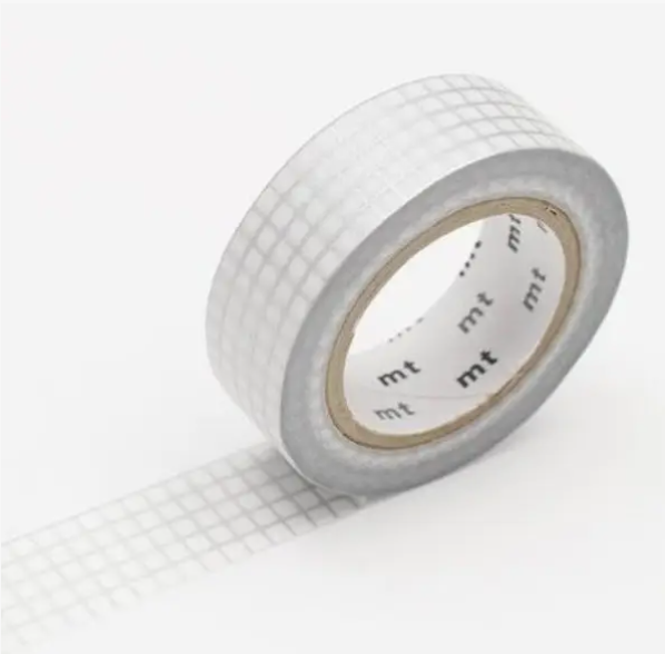 Roll of white tape with grid pattern on a white background