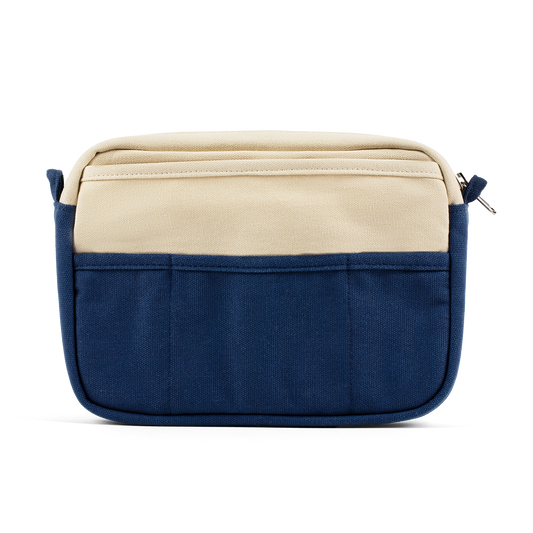 Two-tone blue and beige bag on a white background