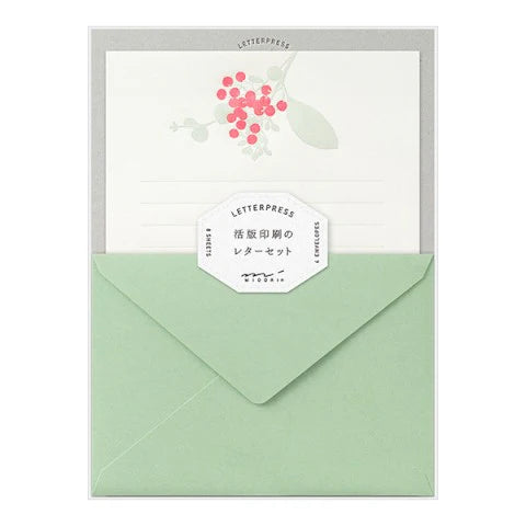 Letterpress card with green envelope on a white background