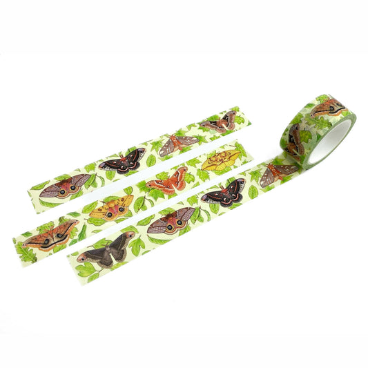 A roll of washi tape with a colorful pattern of butterflies and green leaves on a white background, shown with three strips laid out.
