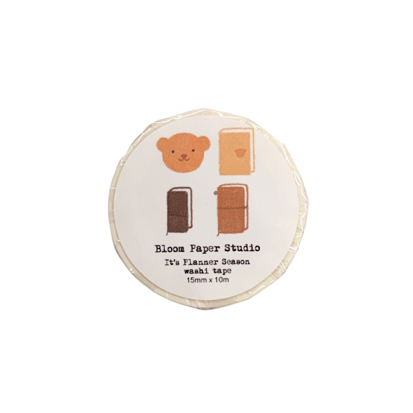 Round washi tape with cartoon bear design and text on a white background