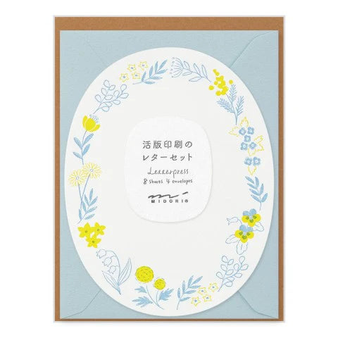 Floral design card with envelope on a light blue background