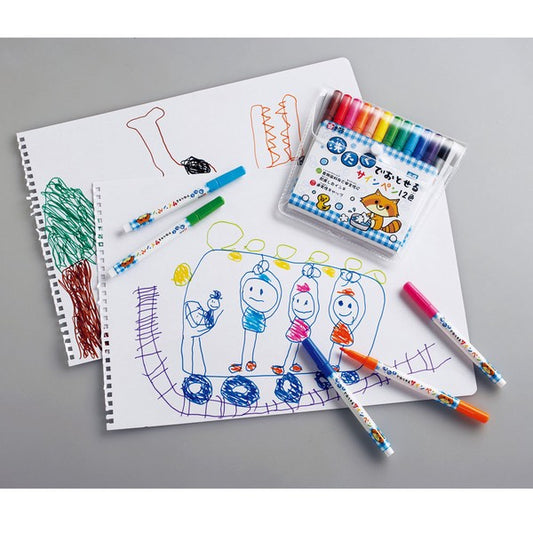 Colorful markers and children's drawings on a gray surface