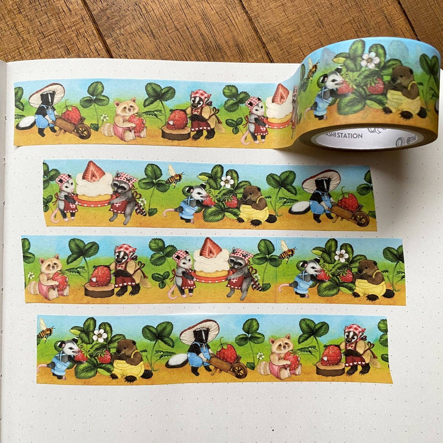Decorative tape with cartoon animal characters on a wooden surface