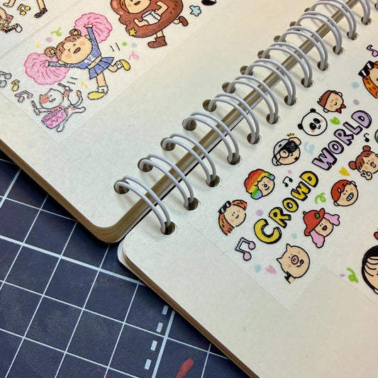 Notebook with cartoon character illustrations on a grid background
