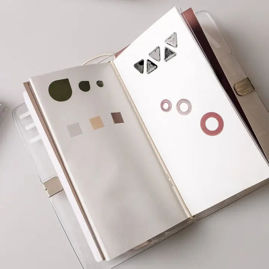 Open book with geometric design on a white background