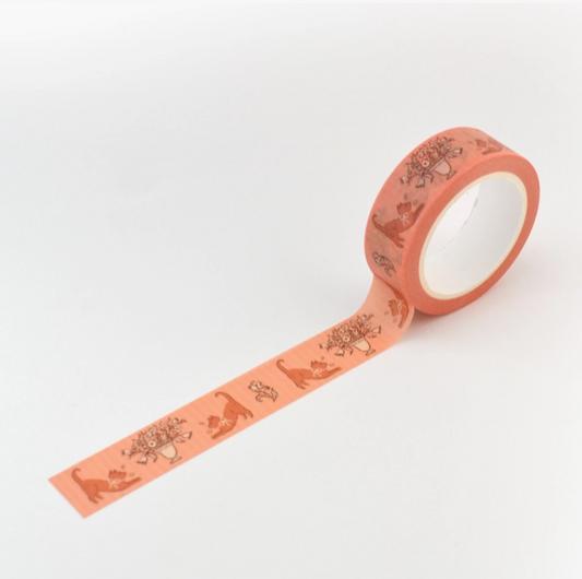 Roll of pink decorative tape with patterns on a white background