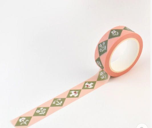 Decorative tape with pink and green pattern on a white background
