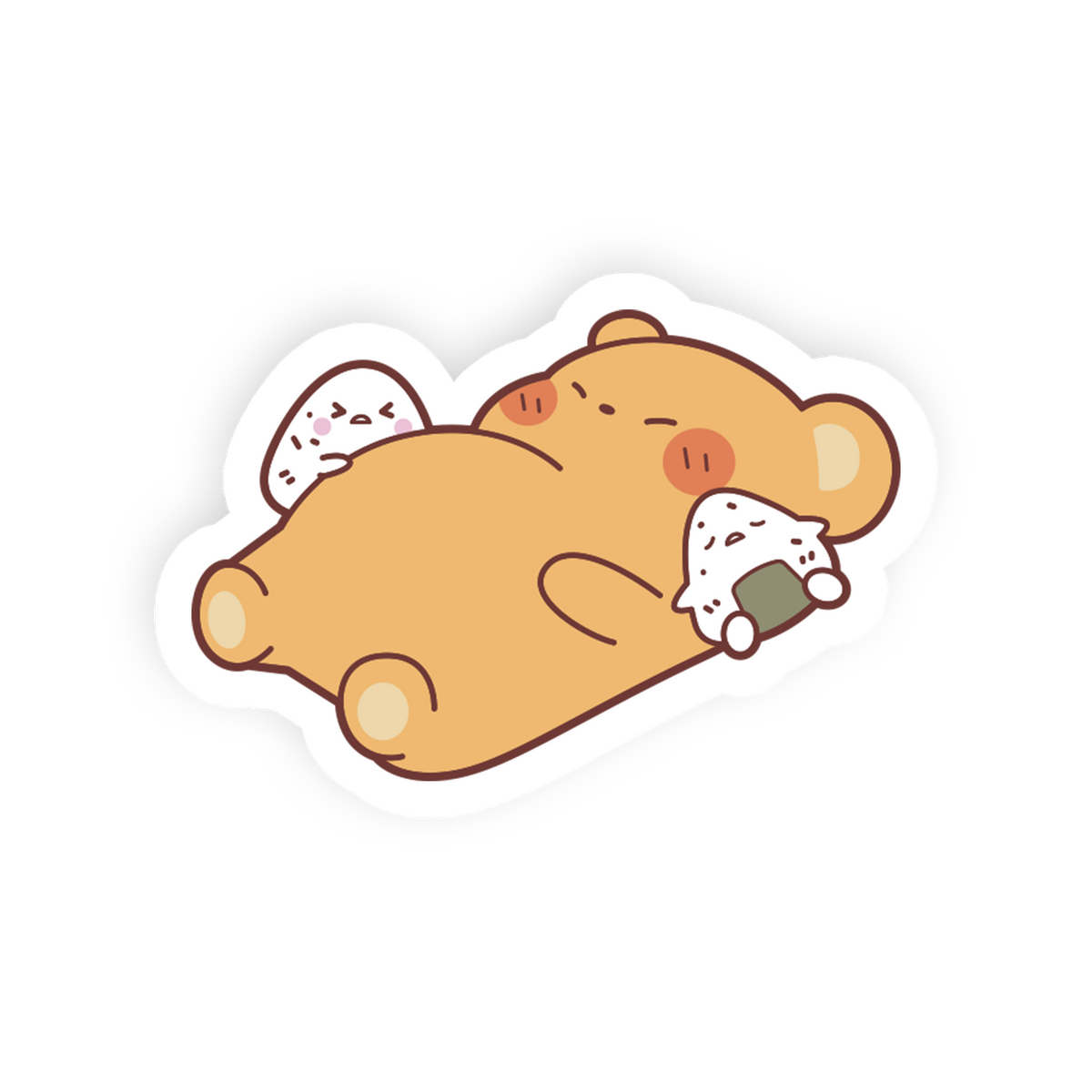 A cute cartoon die-cut sticker of a sleeping tan bear holding two white rice balls, shown on a plain white background.