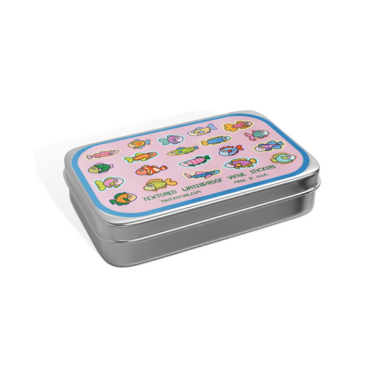 Metal tin with colorful fish stickers on a pink background
