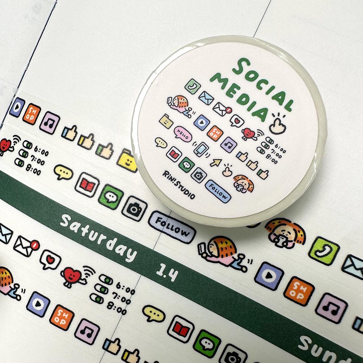 Round white object with 'Social Media' text on a surface with various icons and text.