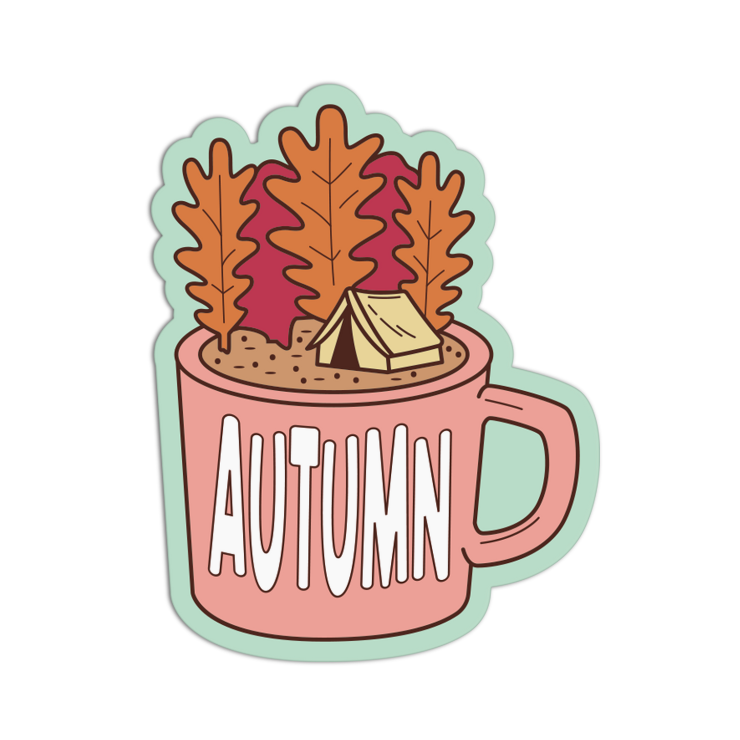 A die-cut sticker featuring an autumn-themed illustration of a pink mug with the word 'AUTUMN' in white, filled with brown leaves, a small beige tent, and a light green outline, shown on a plain white background.
