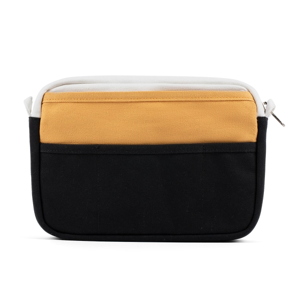 Two-tone black and mustard yellow bag on a white background