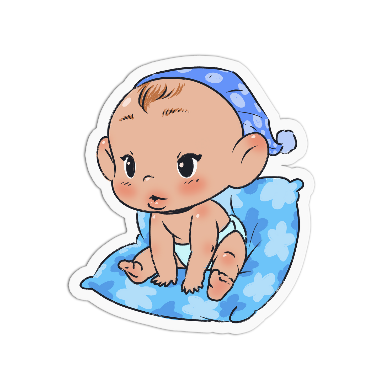 A die-cut sticker featuring a cute cartoon baby sitting on a blue patterned pillow and wearing a blue polka-dot sleep cap, shown on a plain white background.