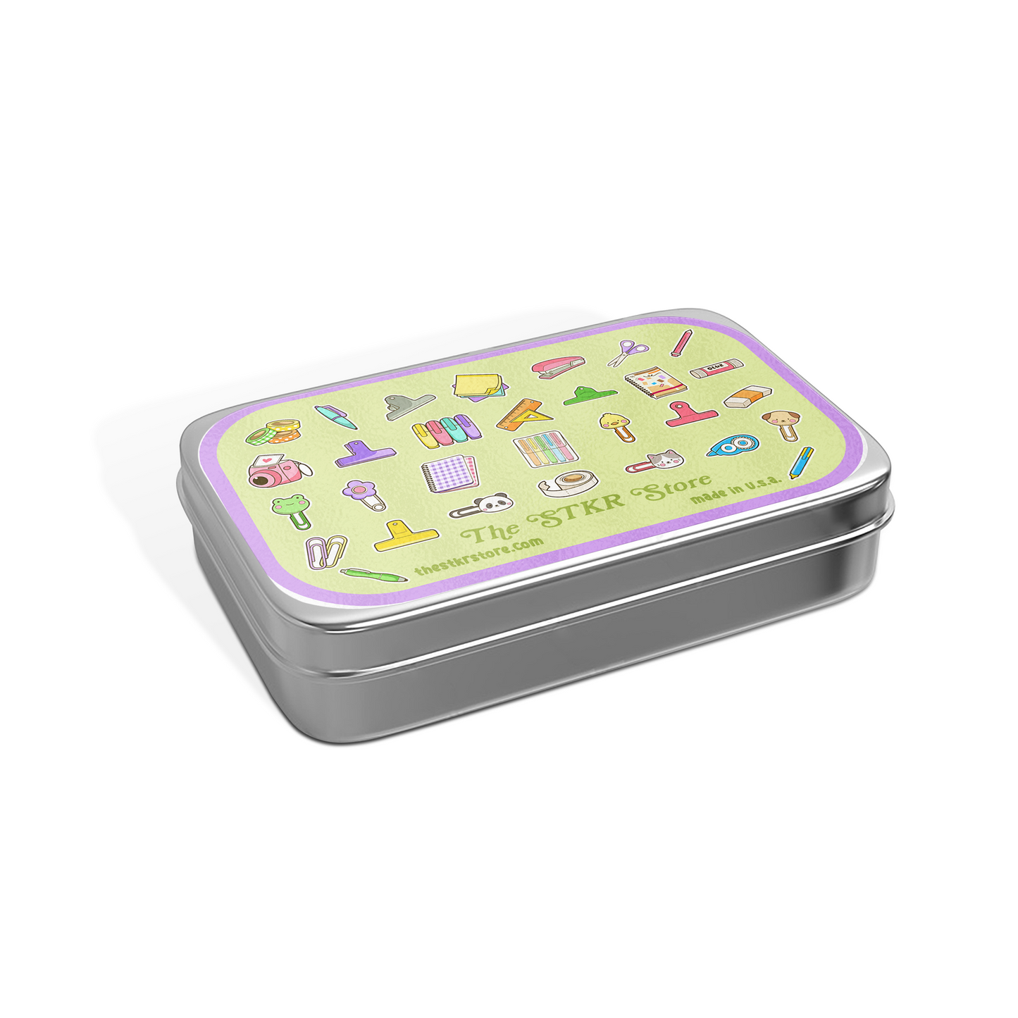 A rectangular silver metal tin with a light green lid featuring colorful illustrated icons and the text 'The STKR Store' and 'SEY 120g'.