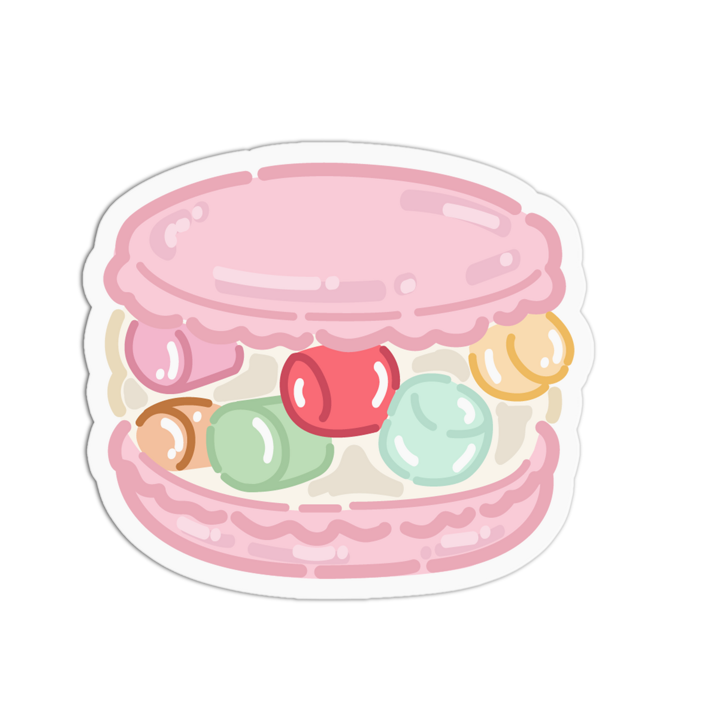 A die-cut sticker featuring a cute, pastel-colored illustration of a macaron filled with colorful candies, shown on a plain white background.