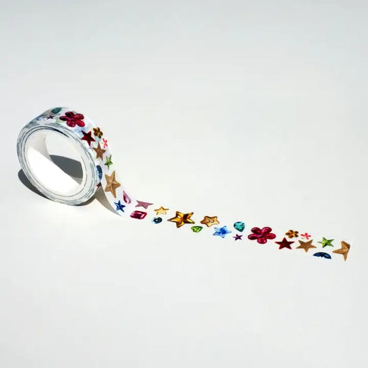 Roll of decorative tape with colorful star and flower designs on a white background