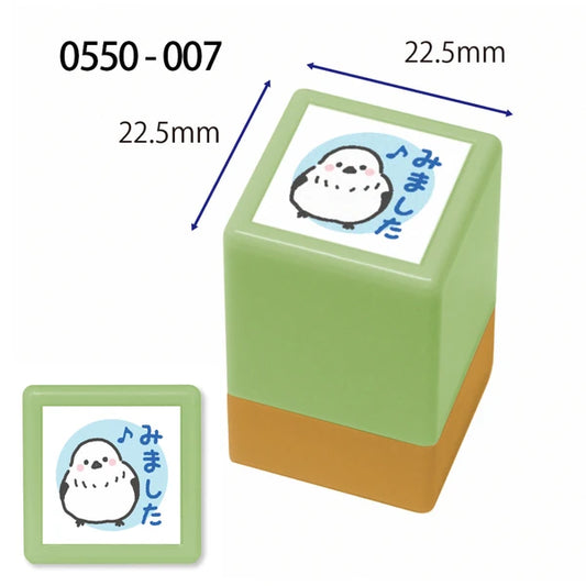 Green rubber stamp with a cartoon character and measurements on a white background