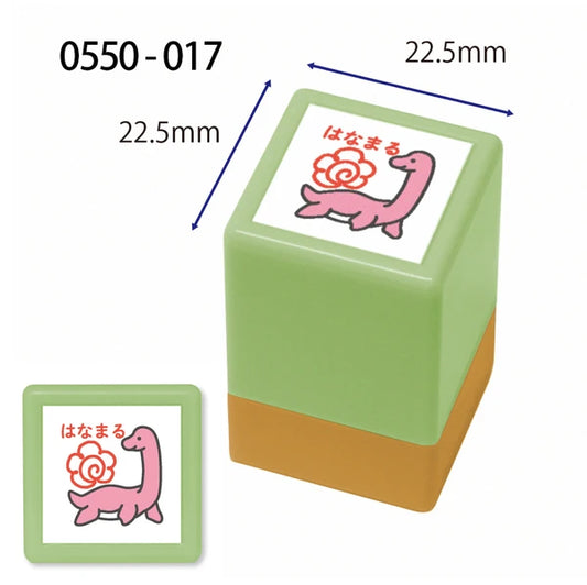 Green rubber stamp with a pink dragon design and measurements on a white background