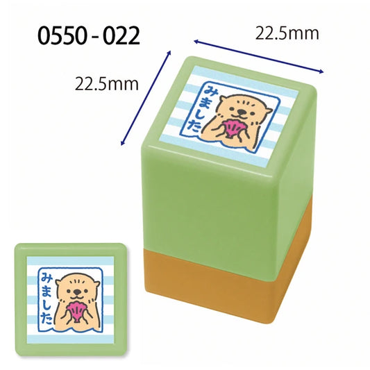 Green rubber stamp with a cartoon design and measurements on a white background