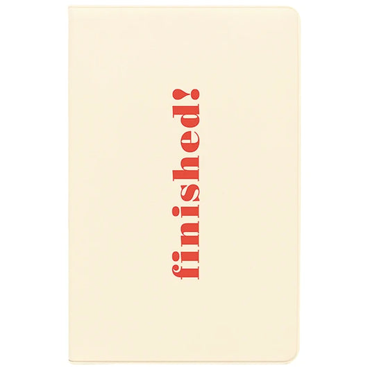 Beige notebook with 'finished!' in red text on a white background
