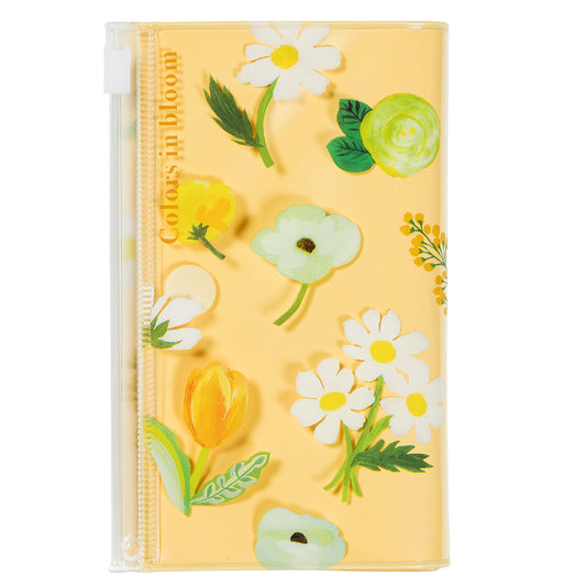 Notebook with floral design on a yellow background
