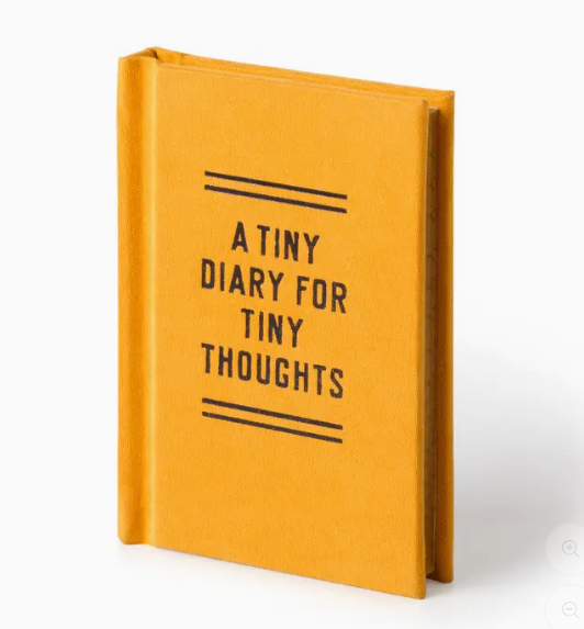 Yellow diary with 'A tiny diary for tiny thoughts' text on a white background