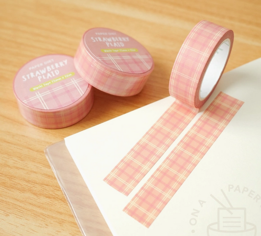 Pink plaid washi tape with containers on a wooden surface