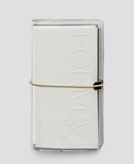 Clear notebook with white interior on a light gray background