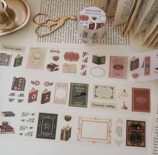 Sheet of decorative stickers with book-themed designs on a surface with books and stationery items.