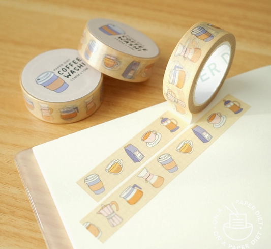 Decorative tape with coffee-themed design on a wooden surface