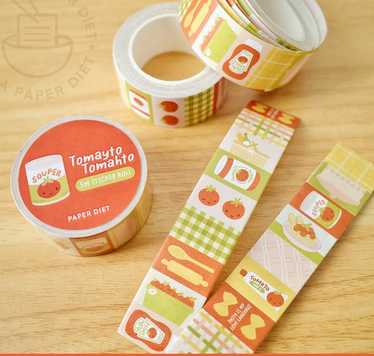 Decorative tape with tomato-themed design on a wooden surface