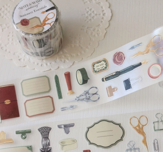 Decorative washi tape with stationery-themed design on a textured surface