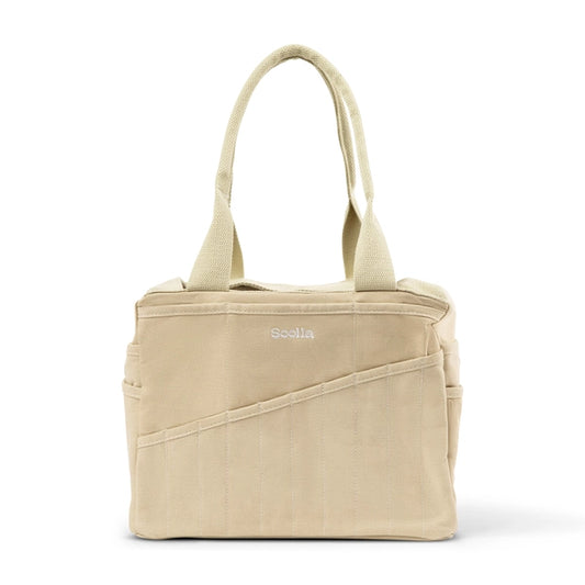Beige tote bag with a visible brand logo on a white background