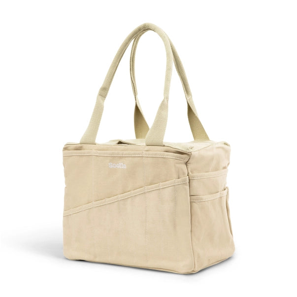 Beige tote bag with multiple pockets on a white background