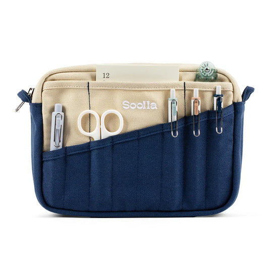 Blue and beige organizer with sewing tools on a white background
