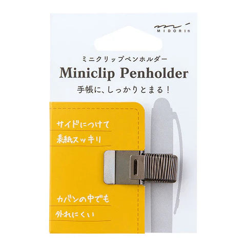 Yellow miniclip penholder with packaging on a white background