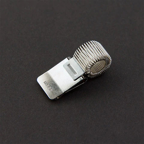 Metallic watch strap with a clasp on a dark background