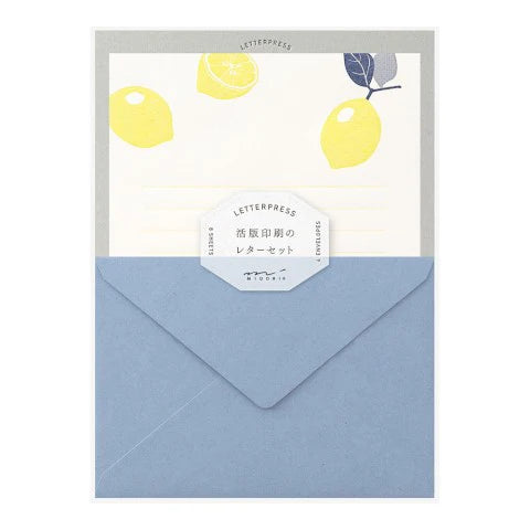 Letterpress stationery set with lemons on a white background