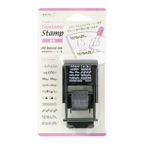 Paintable stamp with ink pad and packaging on a white background