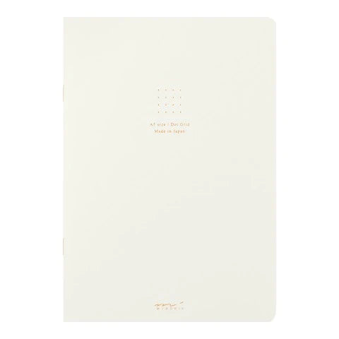 White notebook with gold text on a white background