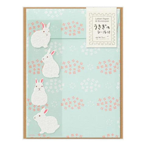 Letter paper with rabbit design on a light blue background