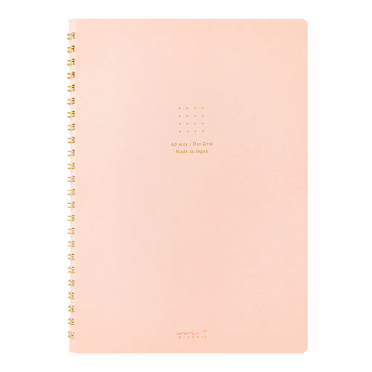Pink notebook with gold text on a white background