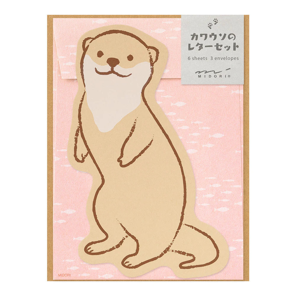 Letter set with an otter design on a pink background, featuring the brand 'MIDORI'.