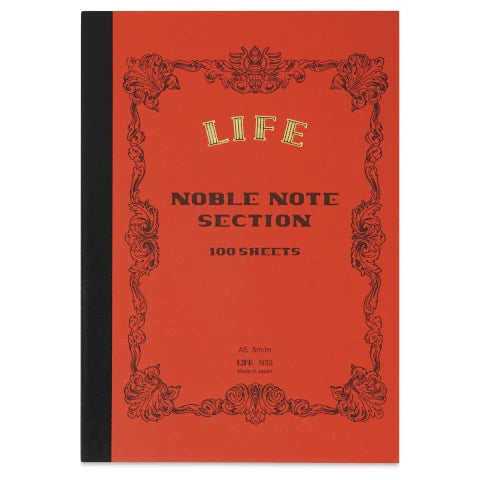 Red notebook with gold and black text and design on a white background