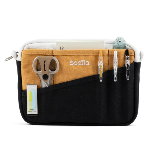 Multifunctional pouch with compartments for scissors, pens, and other items on a white background