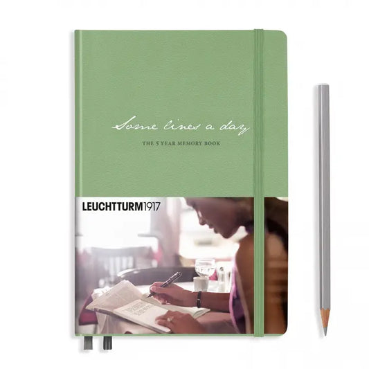 Green notebook with a photo of a person reading on the cover, featuring Leuchtturm1917 branding.