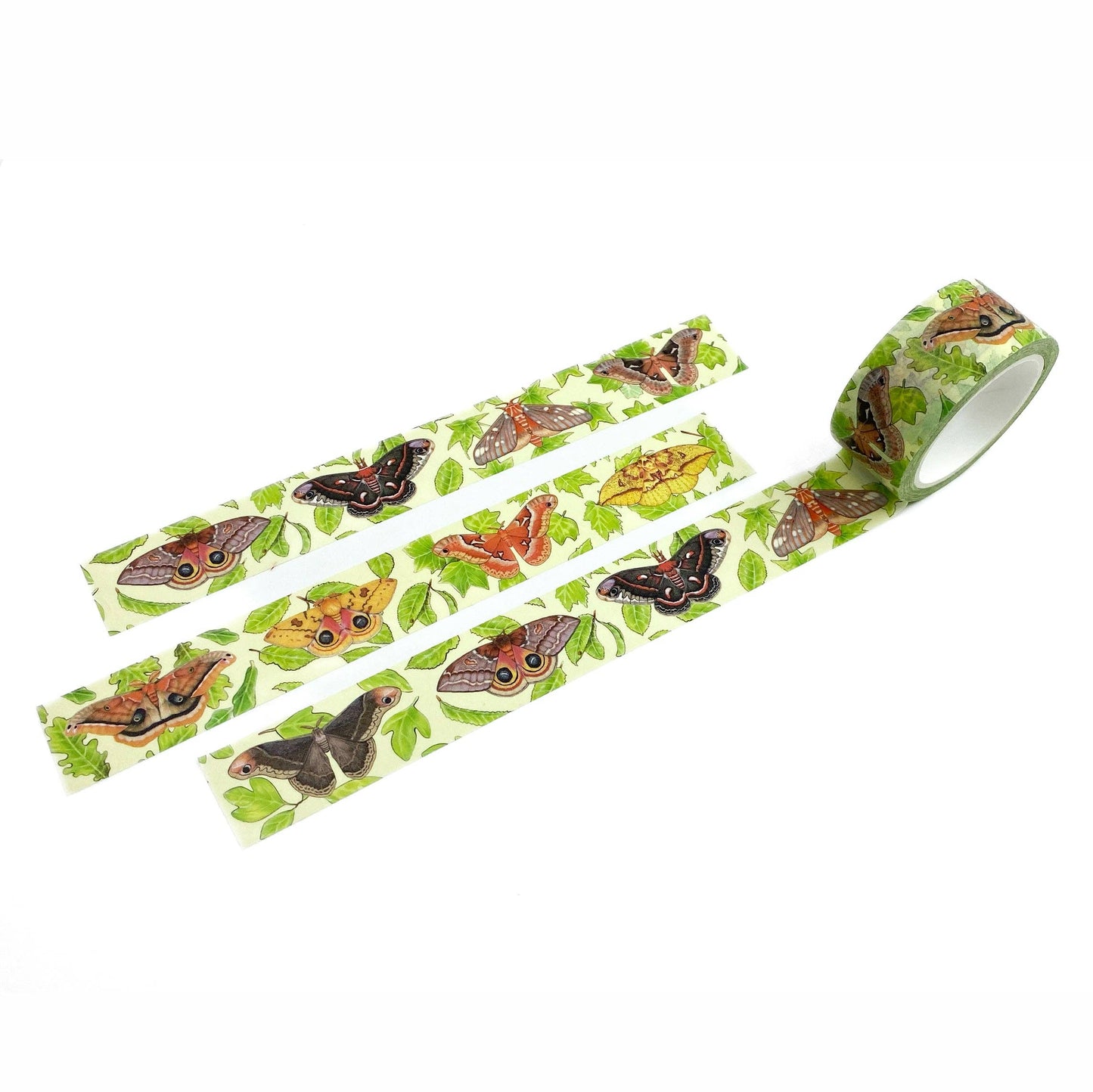 A roll of washi tape with a colorful pattern of butterflies and green leaves on a white background, shown with three strips laid out.