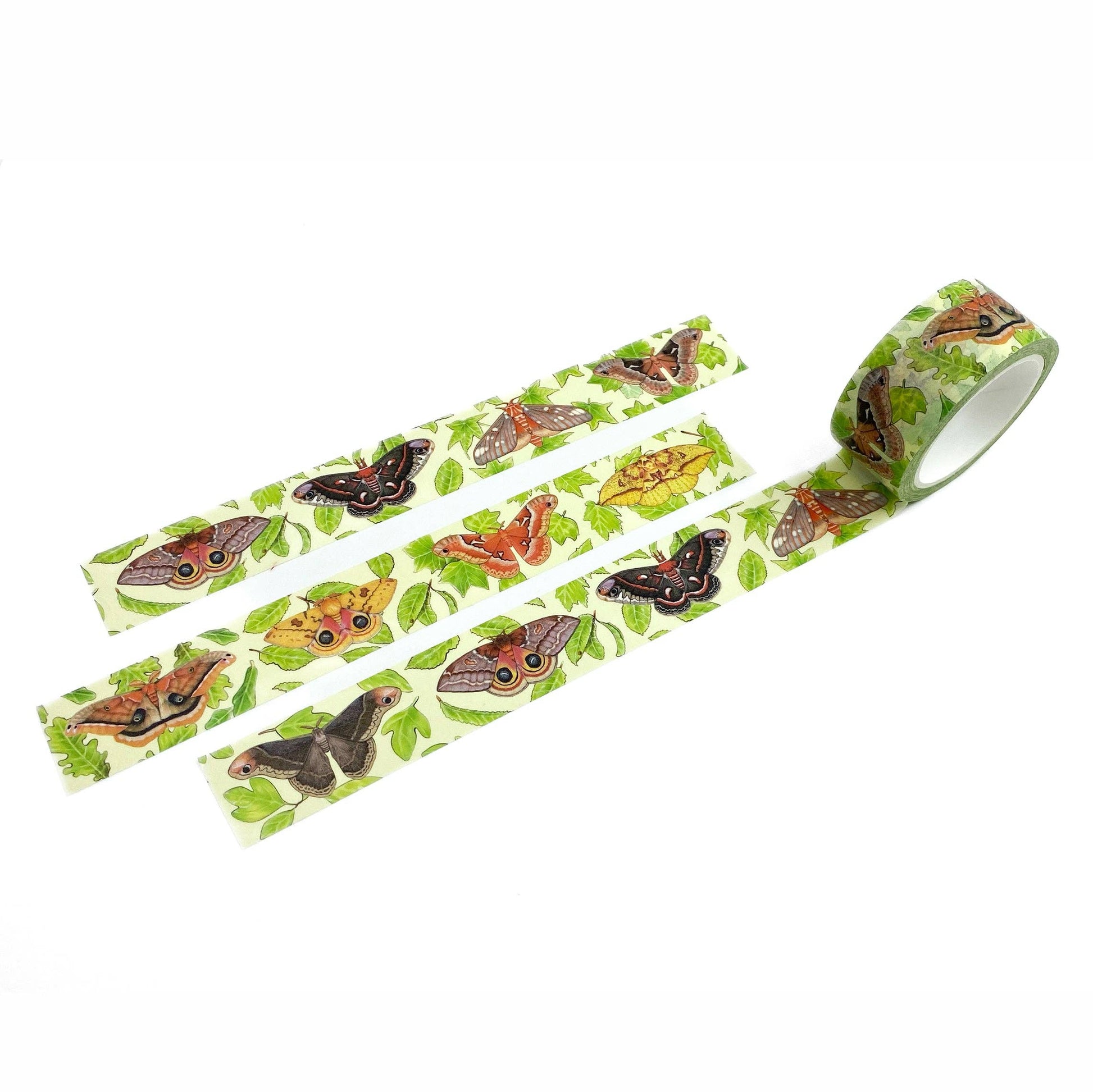 A roll of washi tape with a colorful pattern of butterflies and green leaves on a white background, shown with three strips laid out.